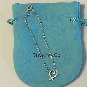 Tiffany & Co. Paloma Picasso Loving Heart Bracelet in sterling silver.